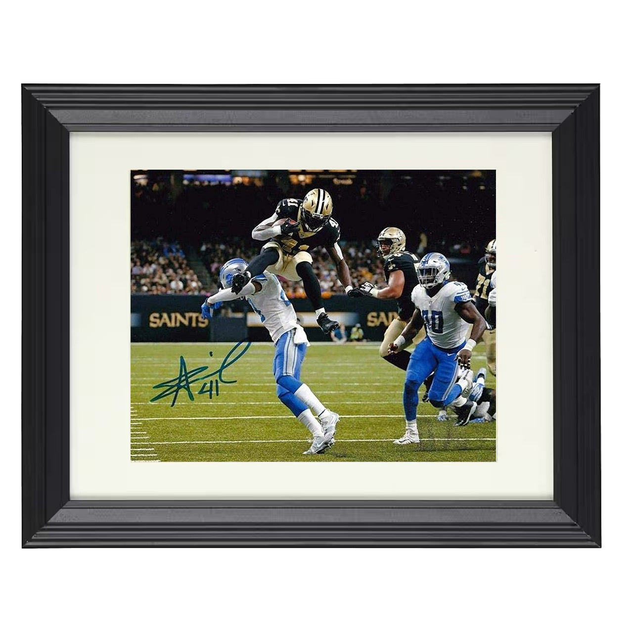 Alvin Kamara – New Orleans Leap Over Defender – 8x10 black beveled framed football wall art