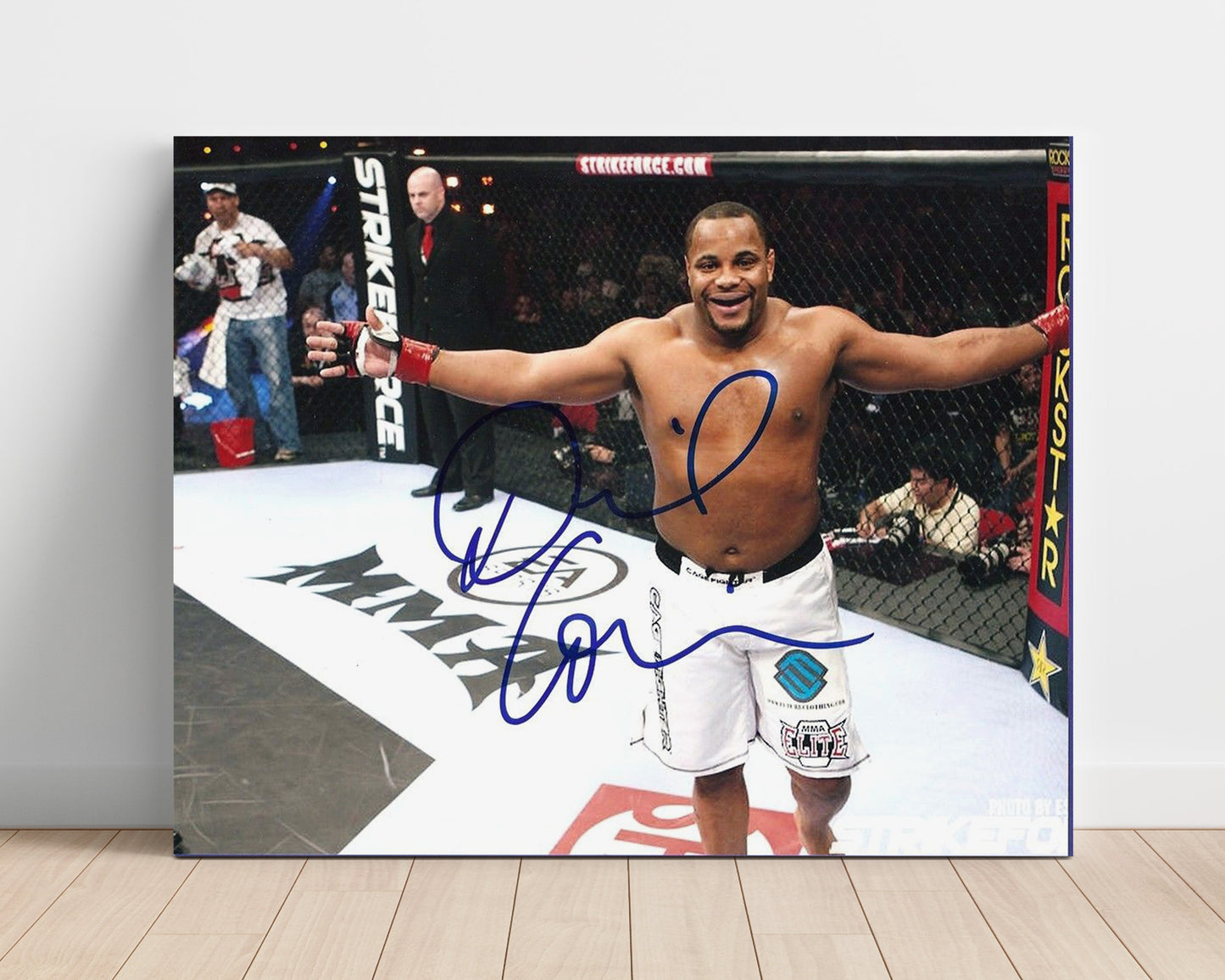 Daniel Cormier - Strikeforce Victory Pose MMA Wall Art 16x20 Unframed Print wall art print – MMA Wall Art decor