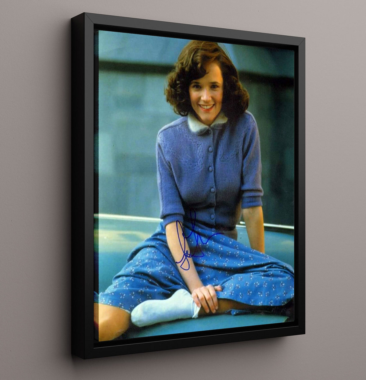 Lea Thompson - Blue Cardigan Smile Sitting movie wall art 16x20 Gallery Frame