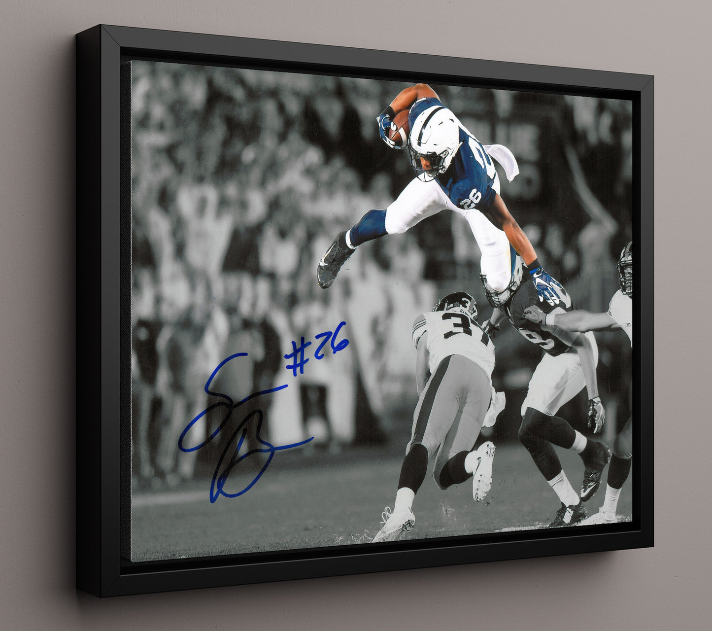Penn State Football Saquon BarkleyMidair Leap College Football Wall Art 16x20 Framed Canvas wall art print – College Football decor