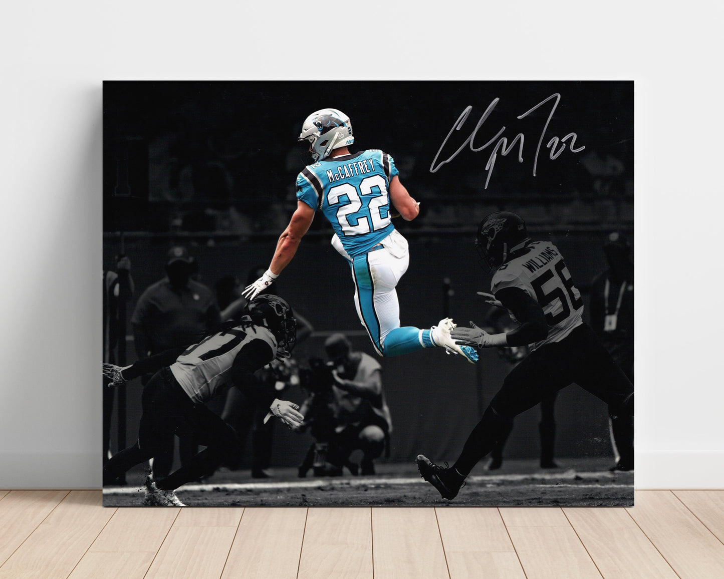 Christian McCaffrey Carolina Leap Over Defender Air CMC Football Wall Art Unframed 8x10 in Plastic Sleeve wall art print - Football decor