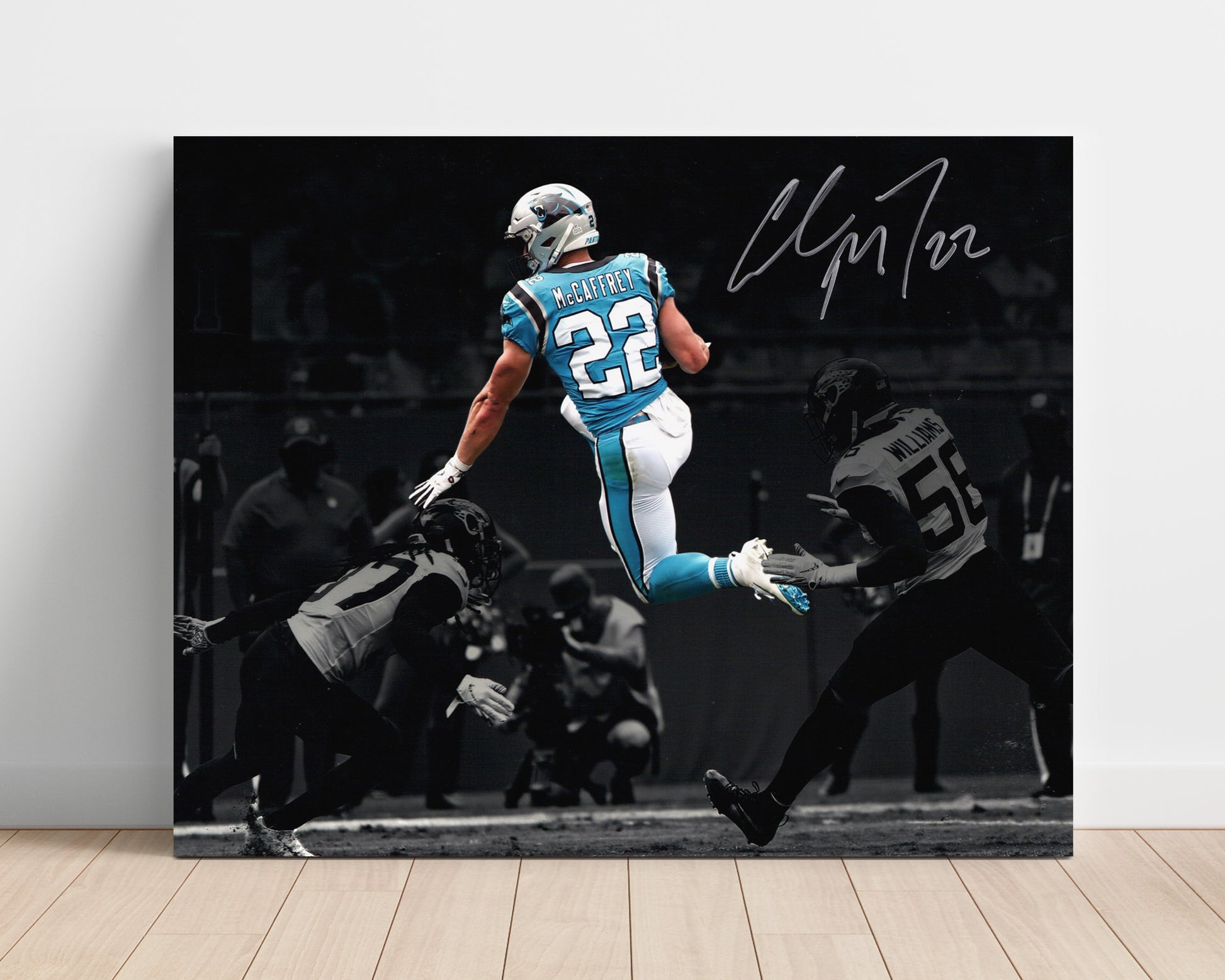 Christian McCaffrey Carolina Leap Over Defender Air CMC Football Wall Art Unframed 8x10 in Plastic Sleeve wall art print - Football decor