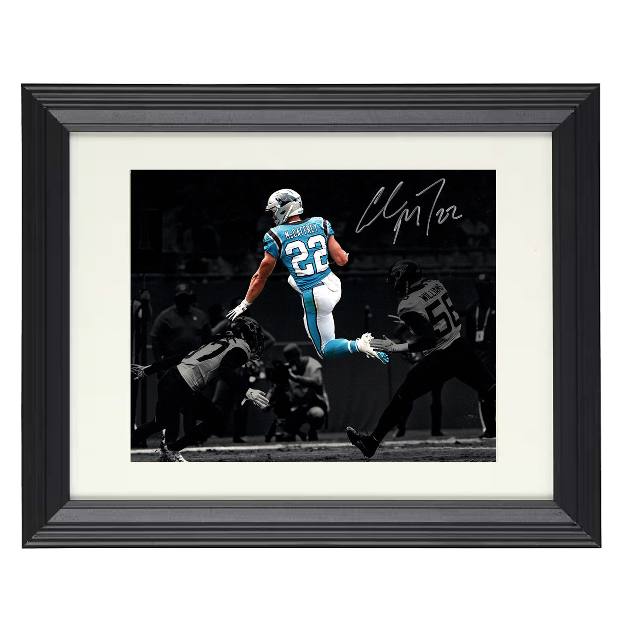 Christian McCaffrey – Carolina Leap Over Defender Air CMC – 8x10 black beveled framed football wall art
