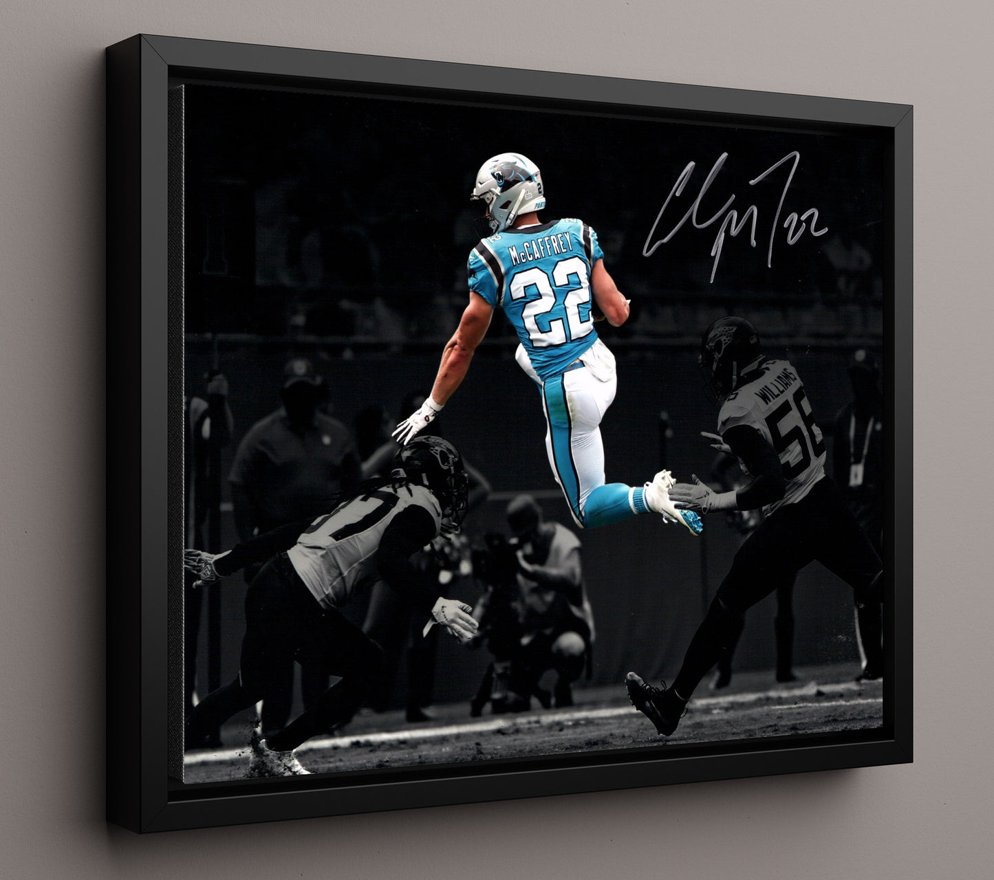Christian McCaffrey Carolina Leap Over Defender Air CMC Football Wall Art 16x20 Floating Canvas Display wall art print - Football decor