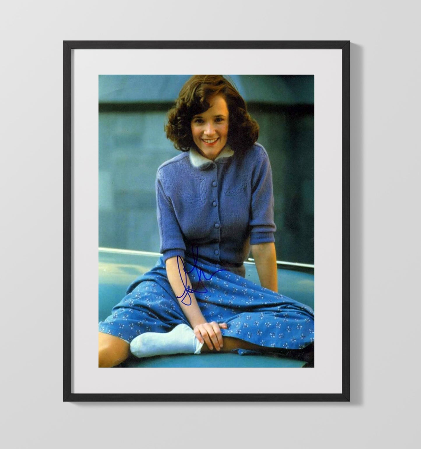 Lea Thompson - Blue Cardigan Smile Sitting movie wall art 16x20 Gallery Frame