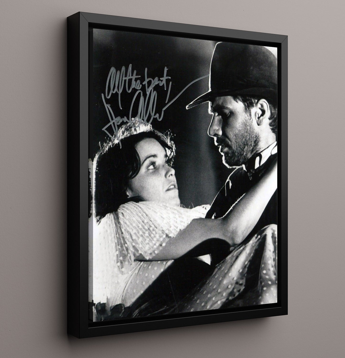 Raiders of the Lost Ark - Karen Allen - Marion Ravenwood and Harrison Ford - Indiana Jones - Rescue Embrace Scene movie wall art 16x20 Framed Canvas