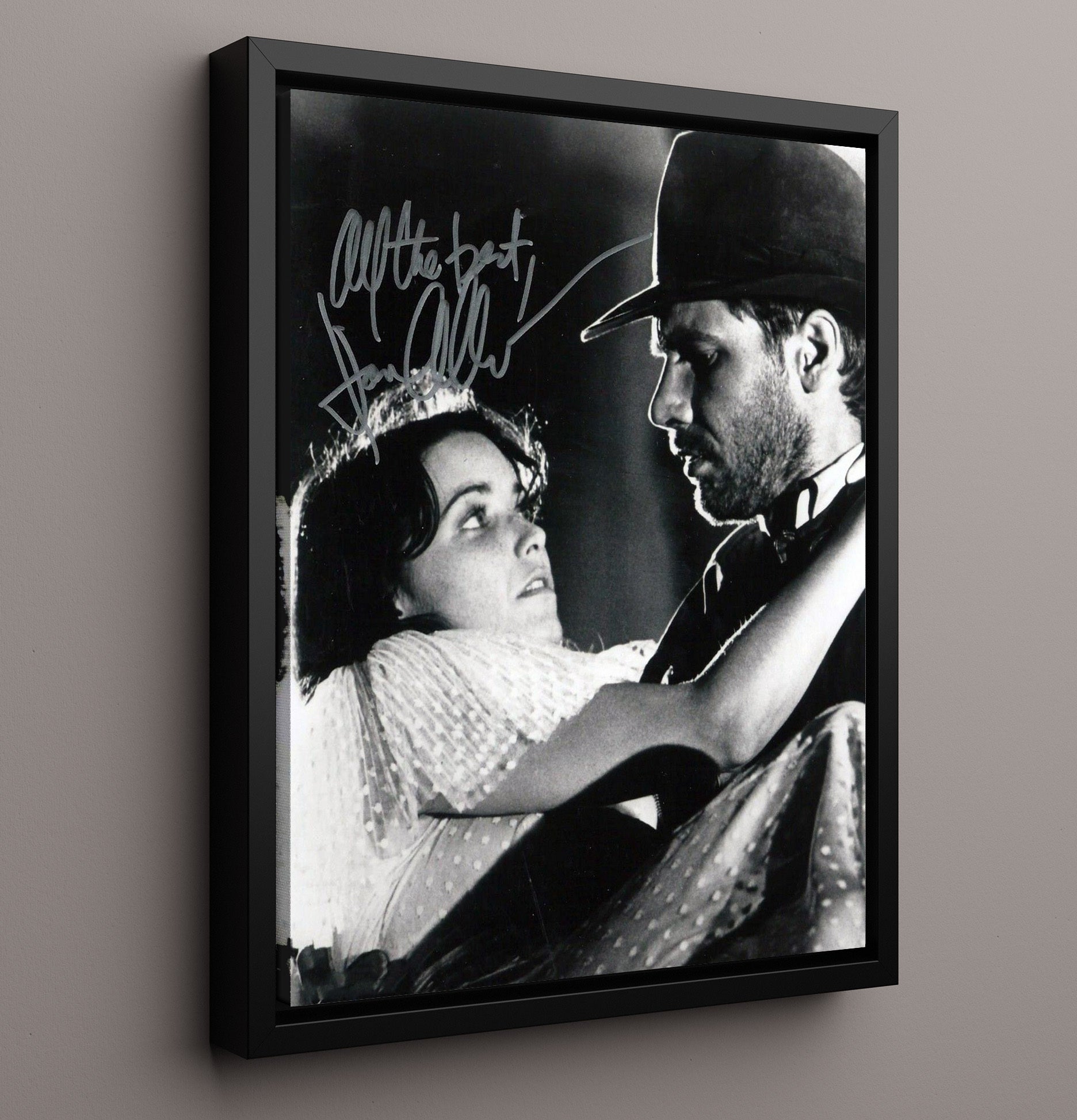 Raiders of the Lost Ark - Karen Allen - Marion Ravenwood and Harrison Ford - Indiana Jones - Rescue Embrace Scene movie wall art 16x20 Framed Canvas
