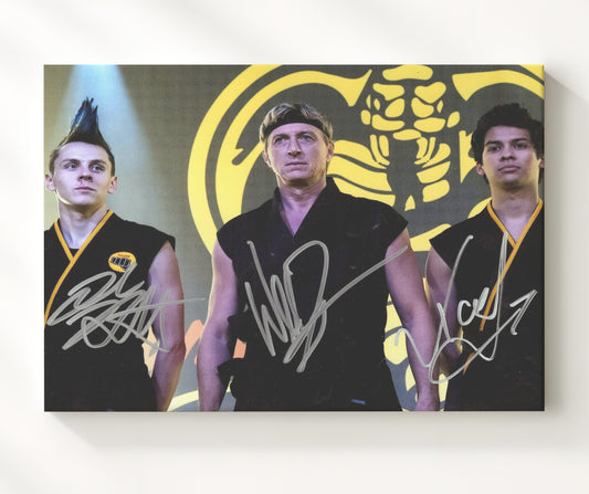 Cobra Kai - William Zabka (Johnny Lawrence) and Xolo Mariduena (Miguel Diaz) and Jacob Bertrand (Hawk) Cobra Kai Dojo Scene - Canvas television wall art